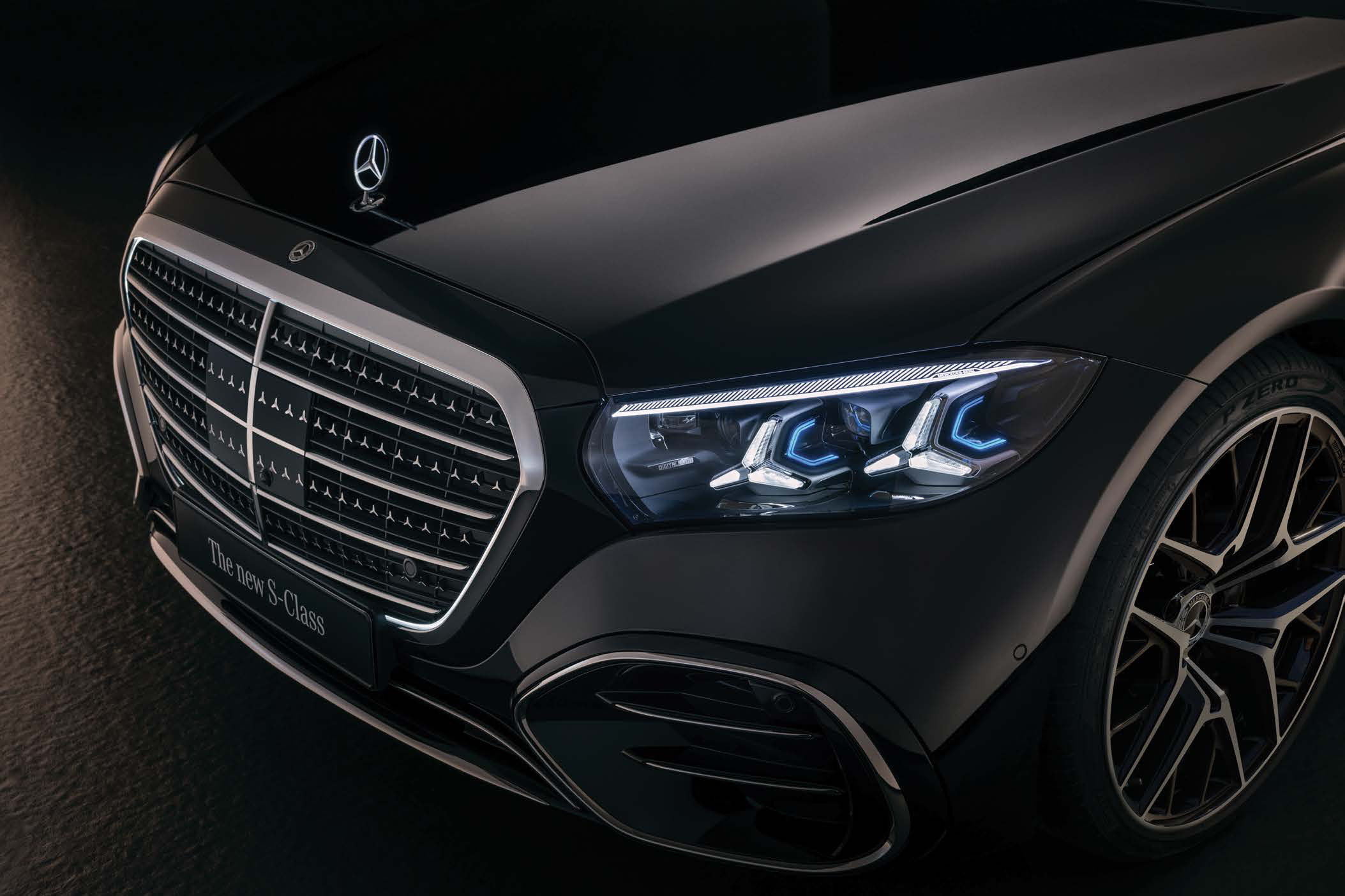 Mercedes-Benz S-Class — Digital Light LED headlamp with blue-accent signature beside the three-pointed-star grille