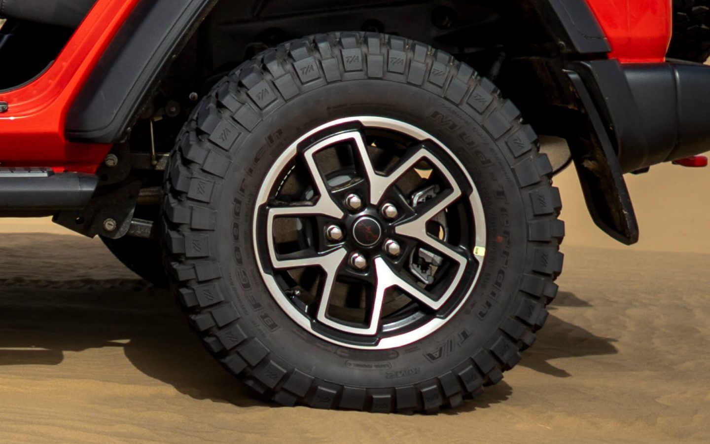Jeep Wrangler — Machined-face alloy wheel wrapped in a chunky mud-terrain tyre