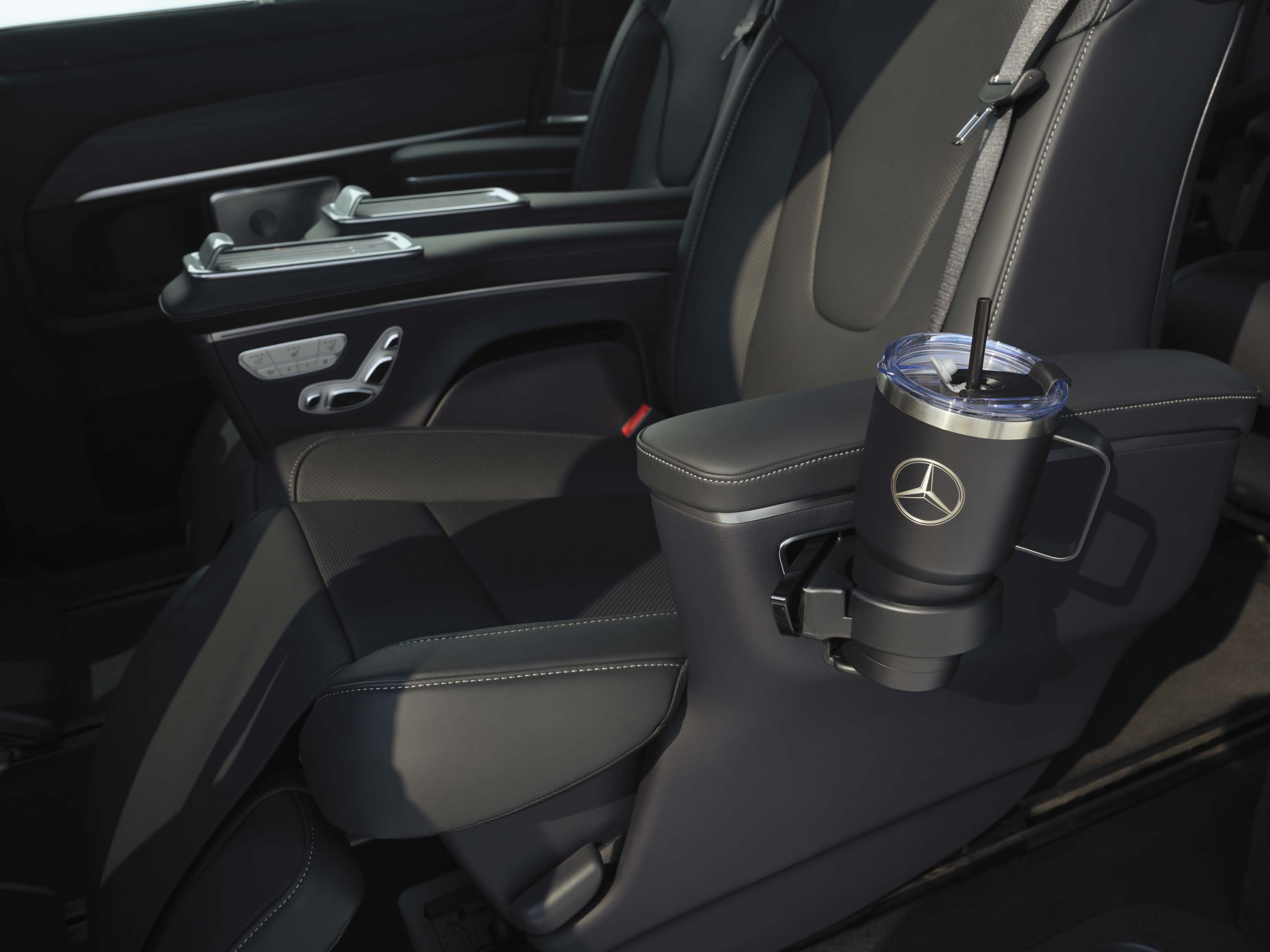 Mercedes-Benz V-Class — Deployable cup holder integrated into the rear luxury-seat armrest that lifts away for cleaning or storage.