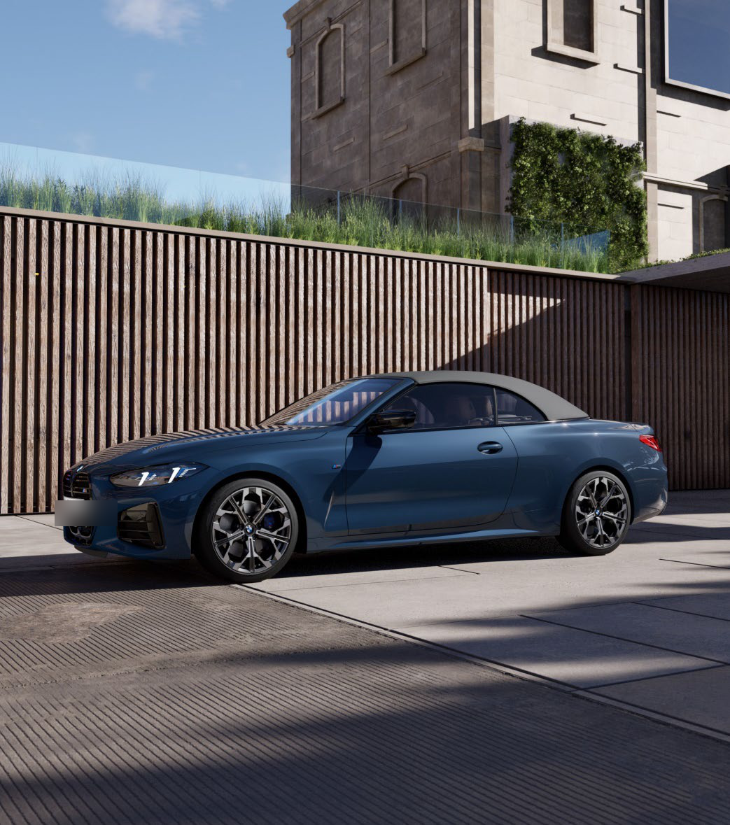 BMW M440i — Fabric soft-top roof shown raised, in a metallic blue exterior finish.