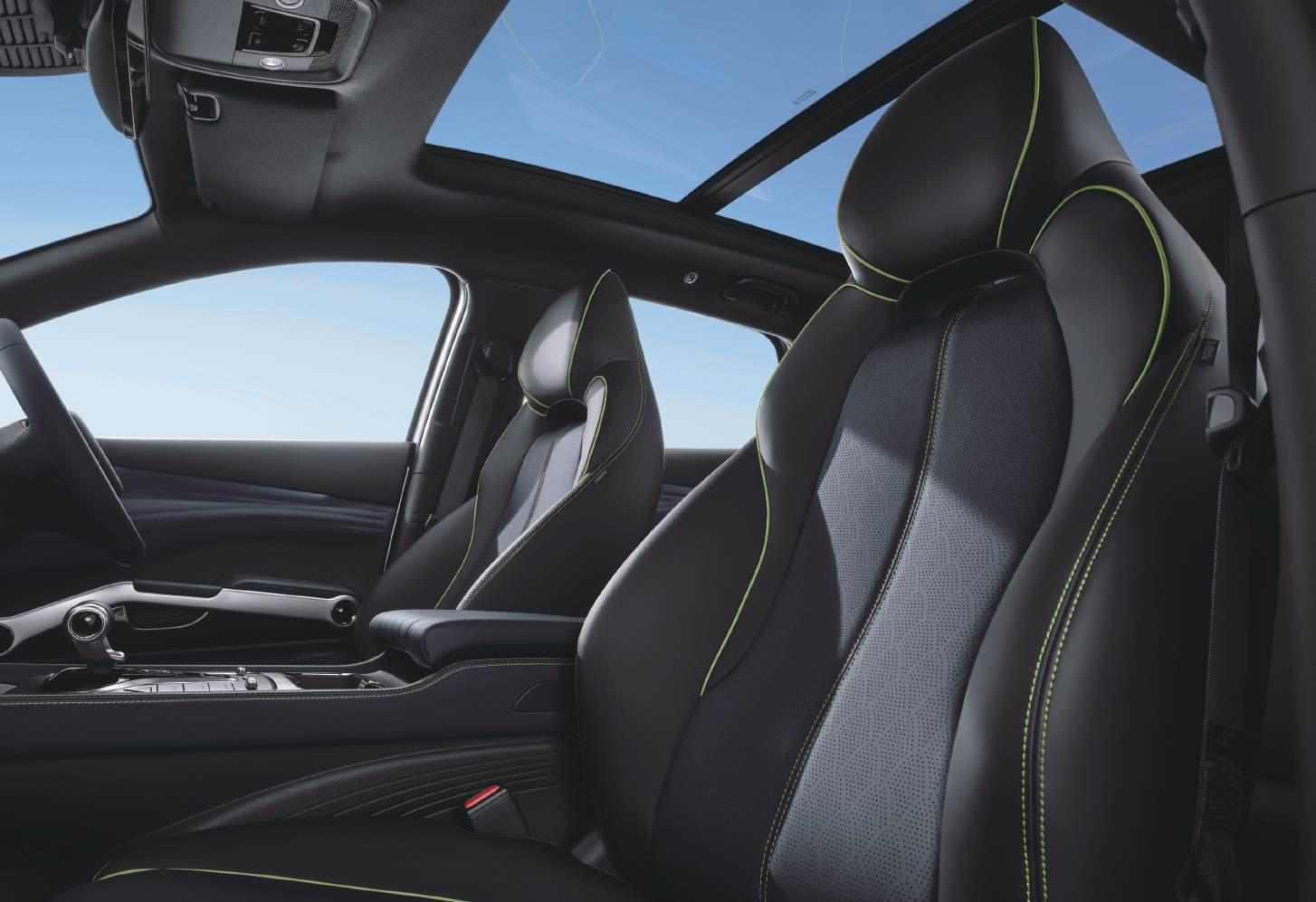 BYD Atto 3 — Sports-style front bucket seats with perforated upholstery and contrast green stitching