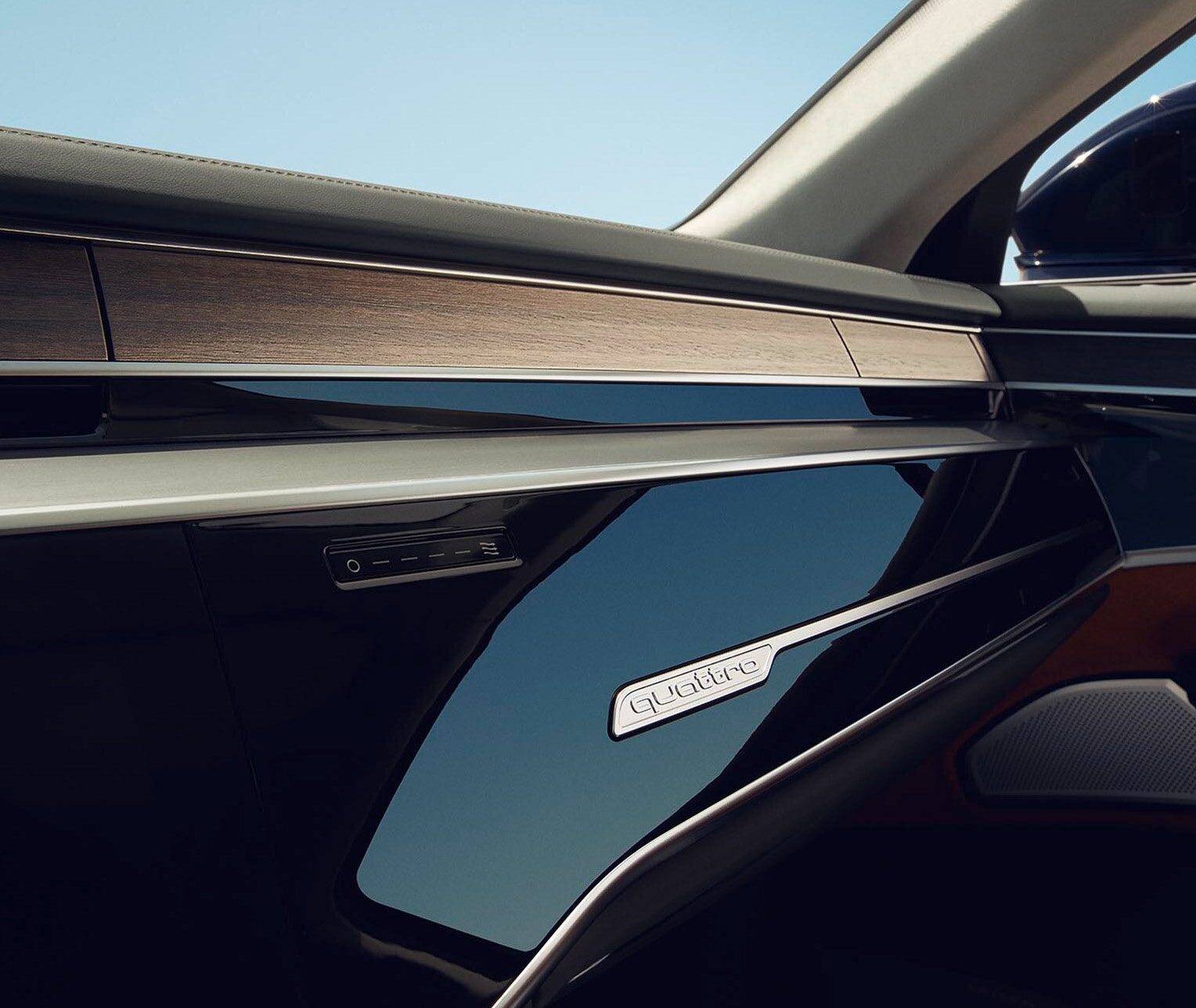 Audi A8 L — Dashboard passenger-side trim in natural wood inlay with quattro badge