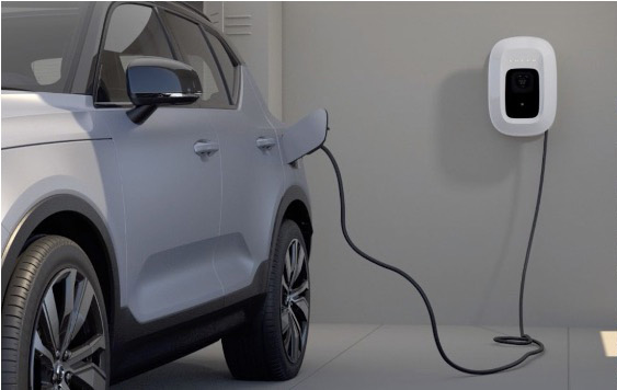 Volvo EC40 — Charging from a wall-mounted AC home wallbox; the 11 kW onboard charger fills the battery in around 8 hours.