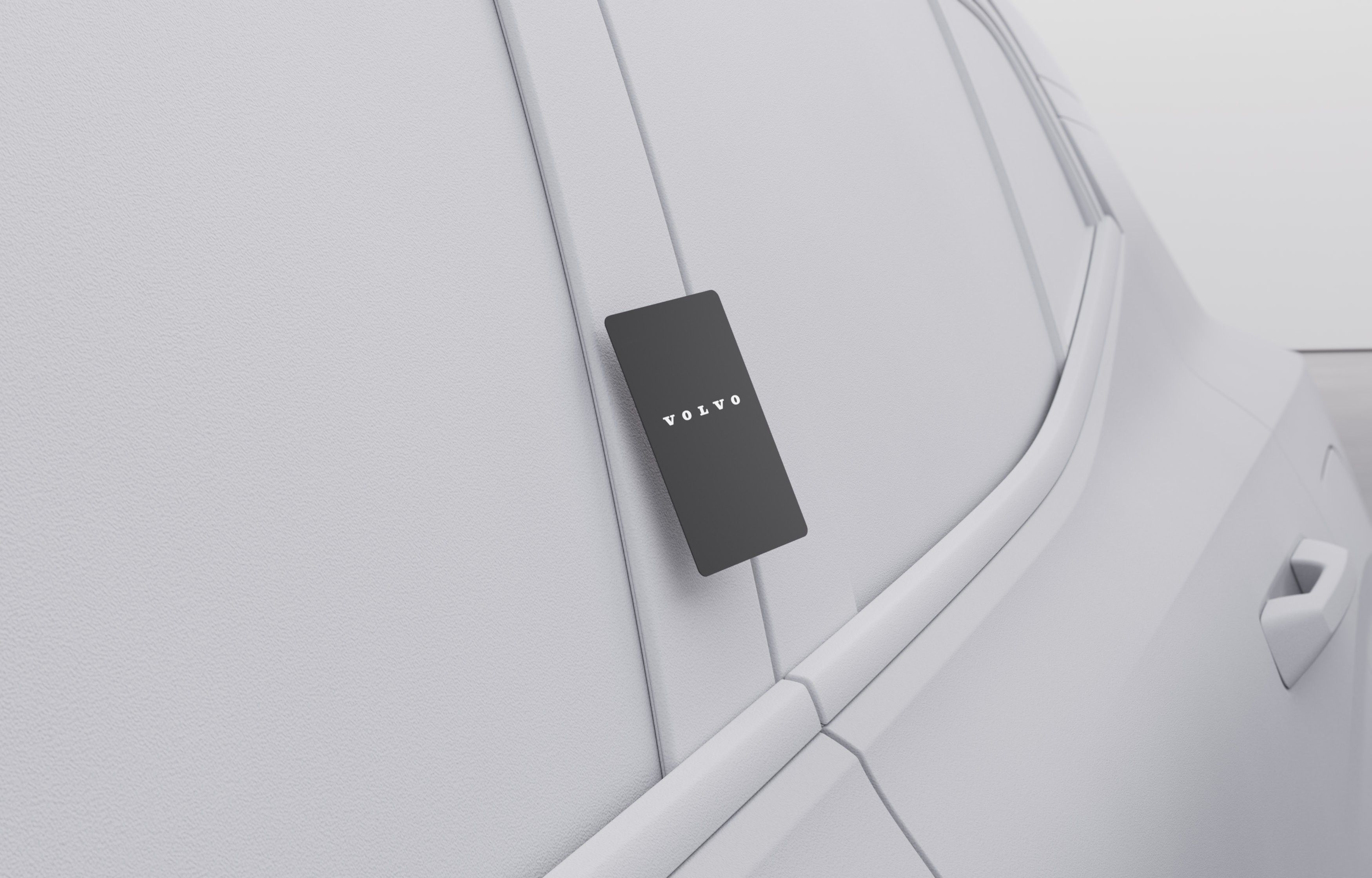Volvo EX30 — Volvo key card held against the body panel for keyless card access.