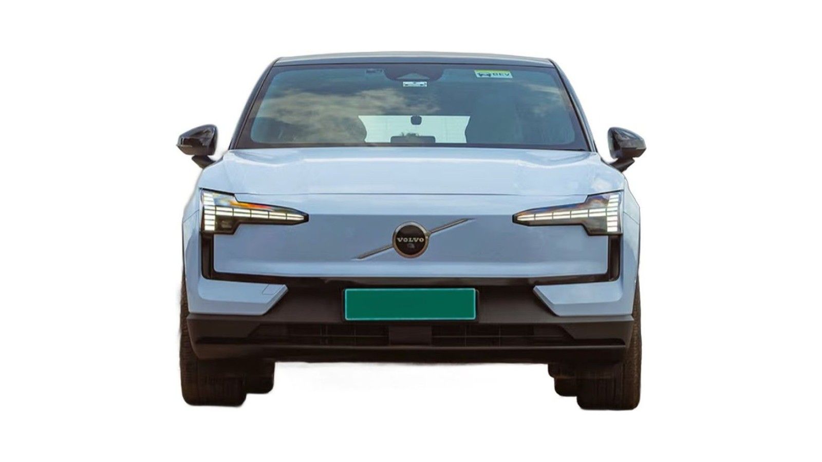 Light blue Volvo EX30 electric vehicle photographed from front, showing grille and headlights.