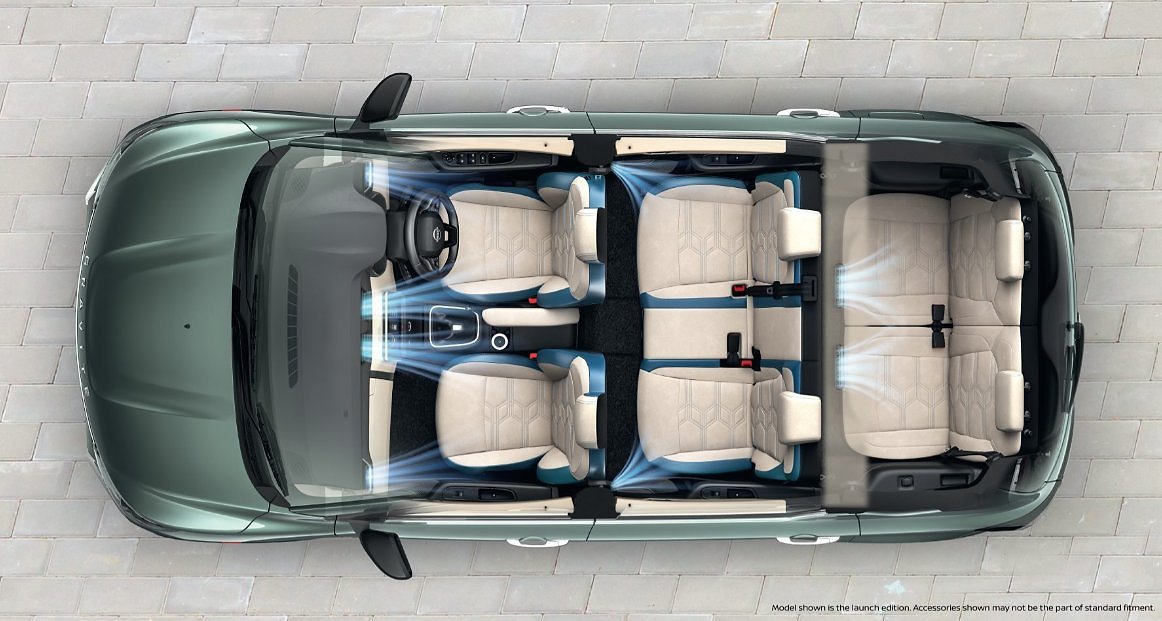 Overhead view of convertible SUV interior with six cream-colored seats and open roof.