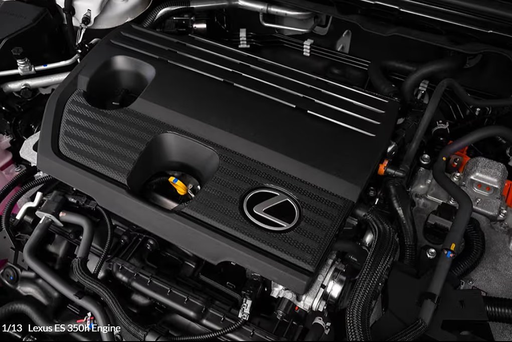 Engine bay of Lexus ES 350h hybrid showing carbon fiber intake cover and components.