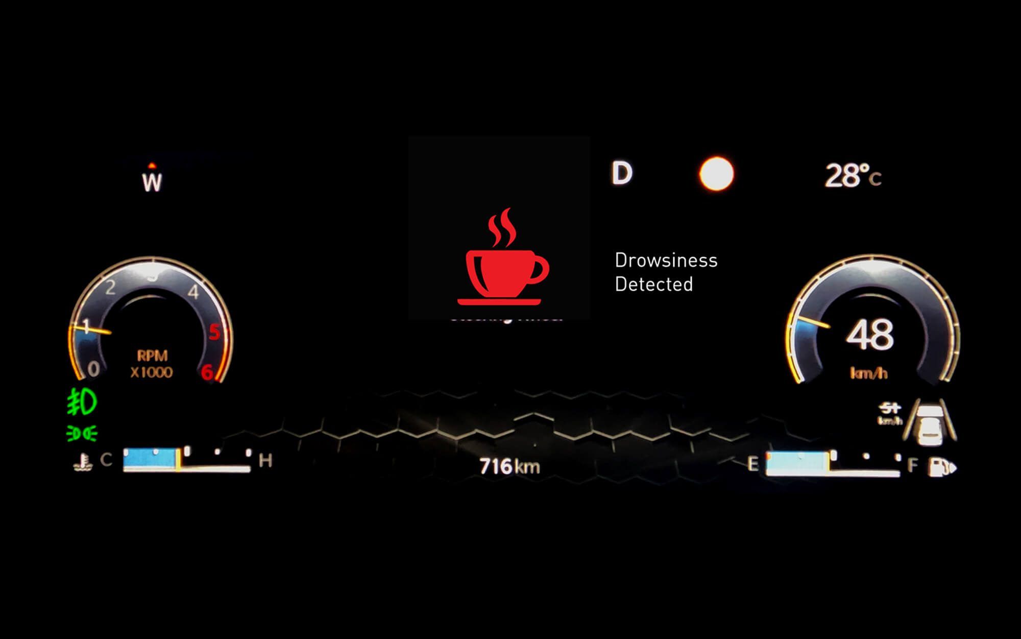 Jeep Meridian — Driver Attention Alert flagging drowsiness with a coffee-cup prompt in the instrument cluster.