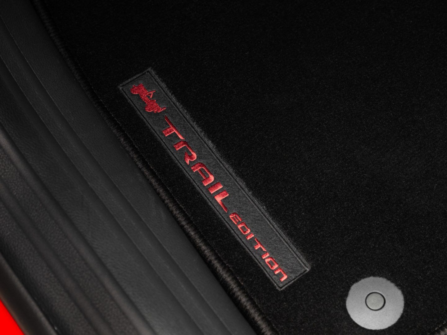 Jeep Compass — Trail Edition floor mats with red embroidered branding.