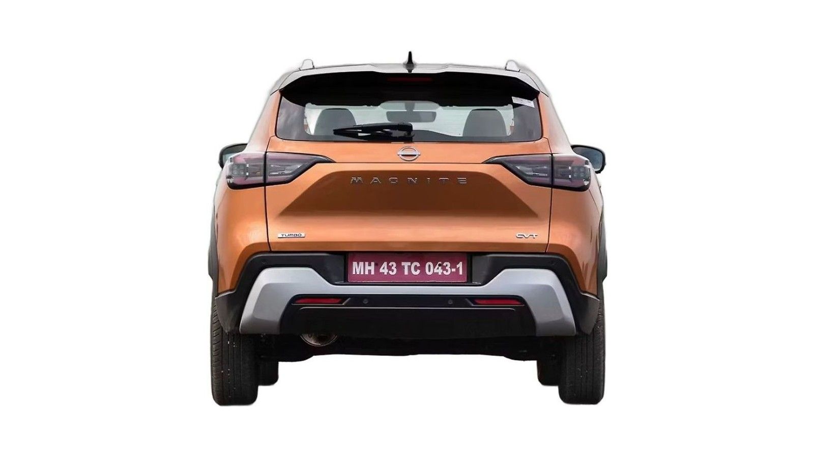 Orange Nissan Magnite compact SUV rear view with license plate visible.