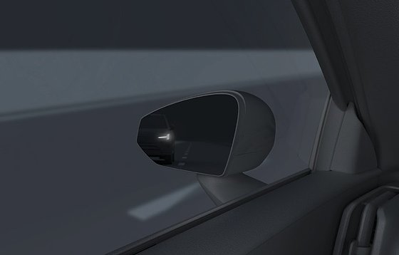 Volvo EX30, Door-mirror blind-spot indicator illuminating as a vehicle approaches from behind.