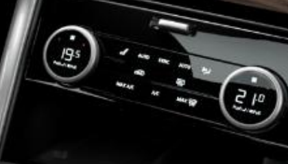 Land Rover Discovery — Three-zone Climate Control with twin rotary temperature dials integrated into the console.