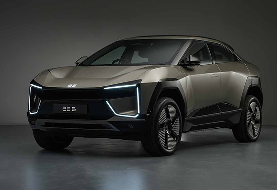 Mahindra BE 6, Sporty coupe-SUV stance with sculpted, aerodynamic surfaces, seen in Desert Myst