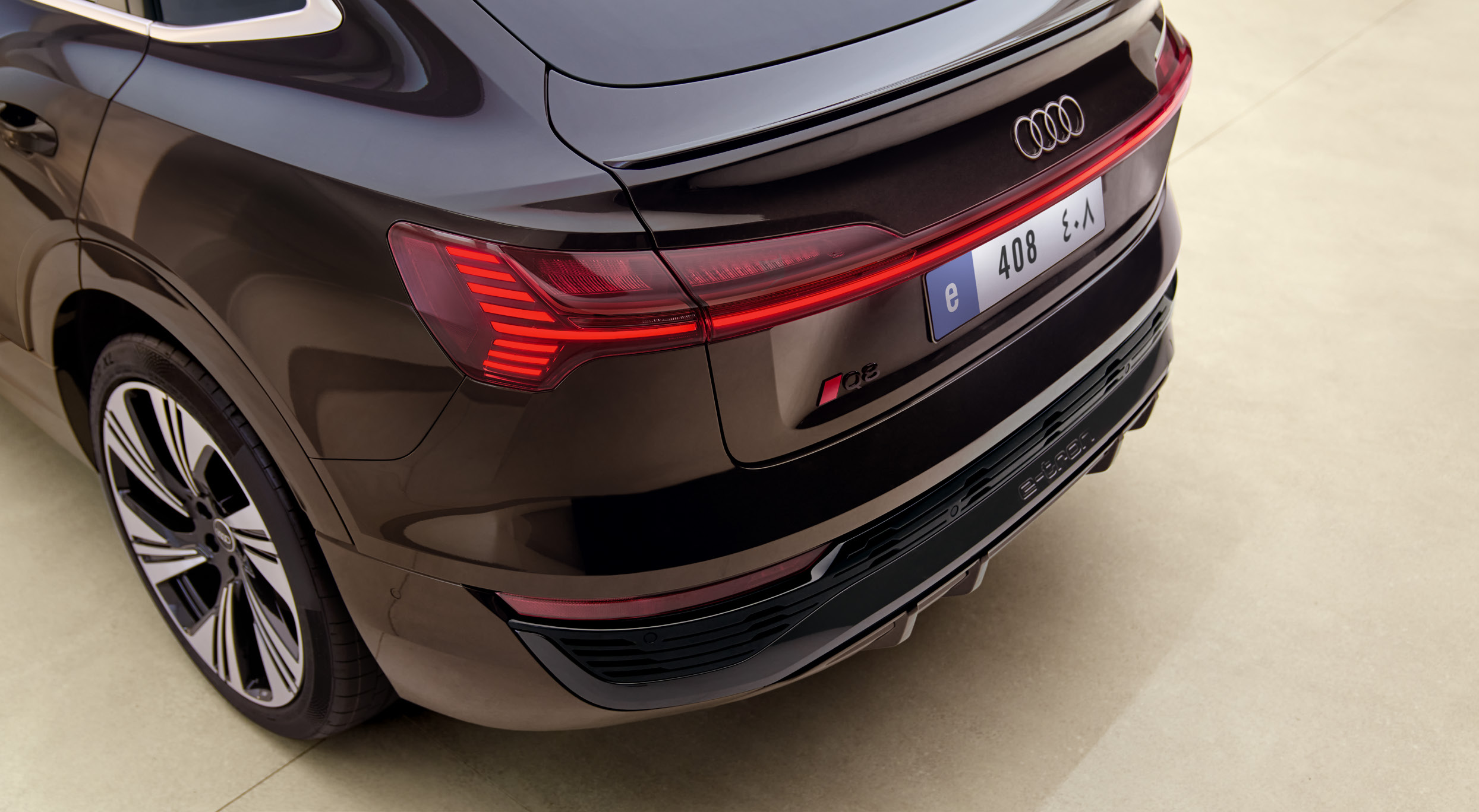 Audi Q8 Sportback e-tron — Full-width LED light bar taillight with four-ring illuminated emblem