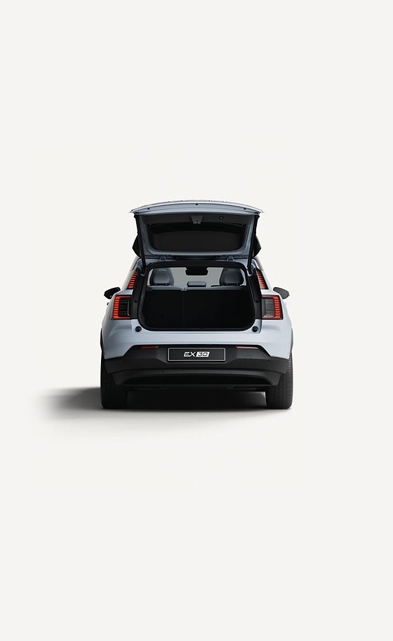 Volvo EX30, Open tailgate revealing the rear luggage compartment with the rear seatbacks folded flat.