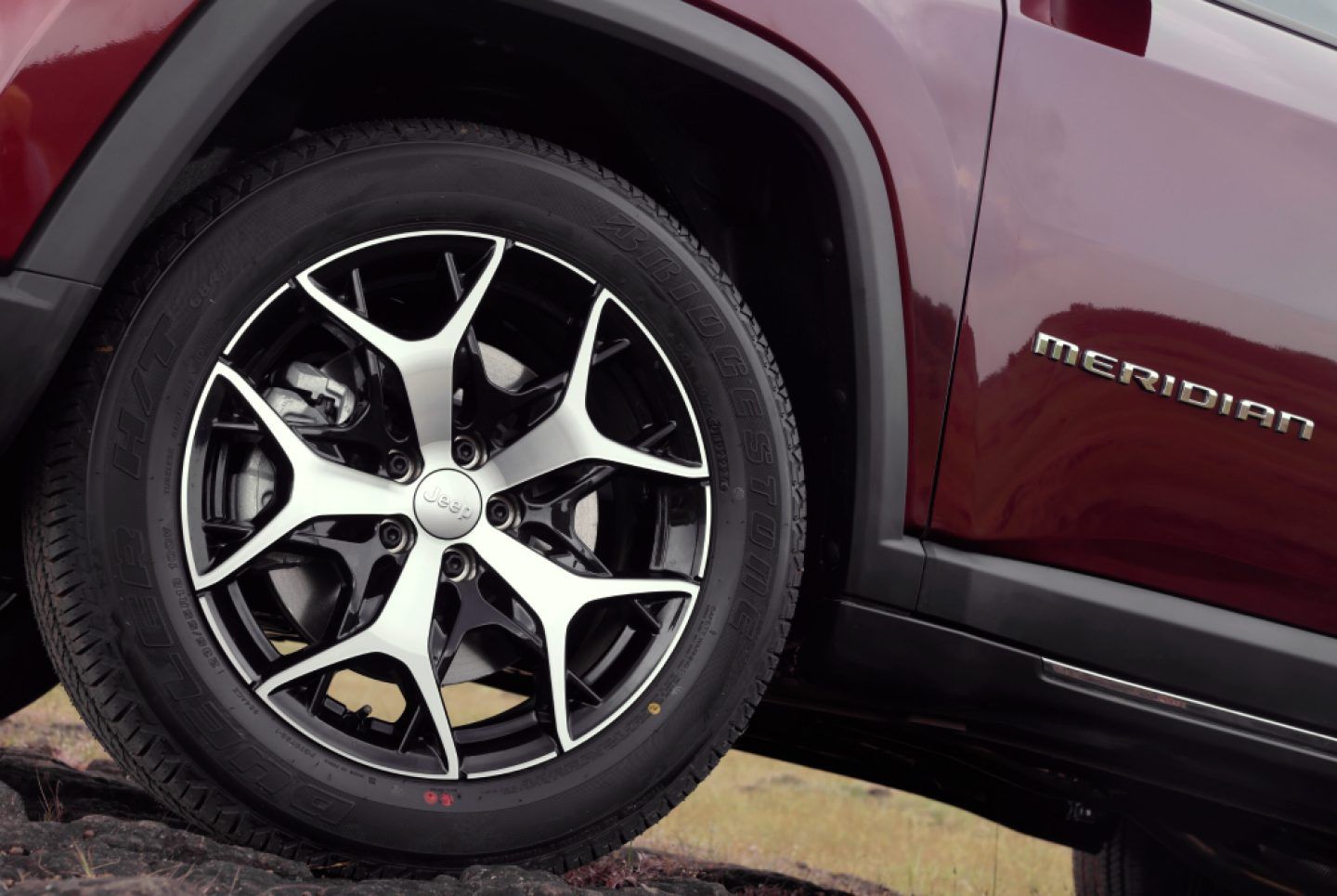 Jeep Meridian — Diamond-cut dual-tone alloy wheel, with the Meridian lettering on the front door.
