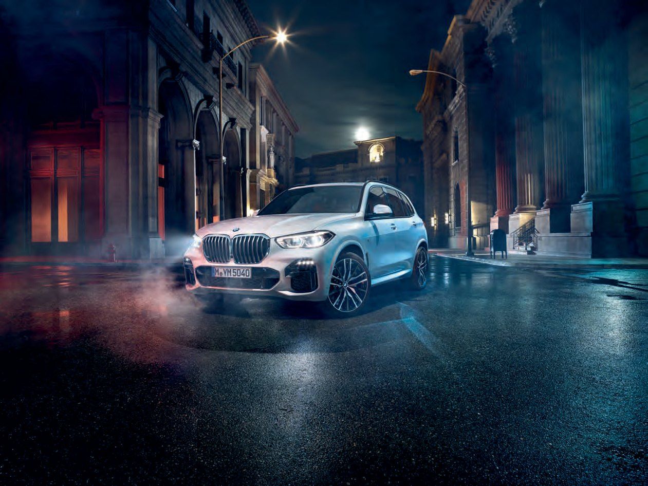 BMW X5 — Athletic presence under dramatic lighting
