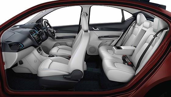 Tata Tigor EV, Dual-tone cabin with plush leatherette upholstery, blue contrast stitching and a foldable rear armrest with cup holders